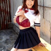 Adorable Oriental solo female Ria Sakuragi letting her enormous all-natural breasts loose from a sailor uniform