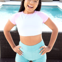 Little Latina teenager Summer Col is stripped down to over the knee socks and joggers by a pool