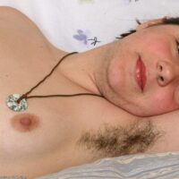 First timer displays her furry underarms before unleashing her bald pussy