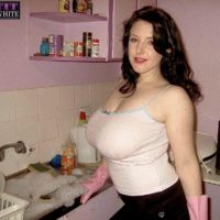 Dark-haired MILF Angela Milky modelling non au naturel in mini-skirt and in bathroom and kitchen