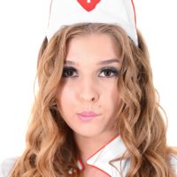 Solo model Alina N works herself free from a sexy nurse uniform